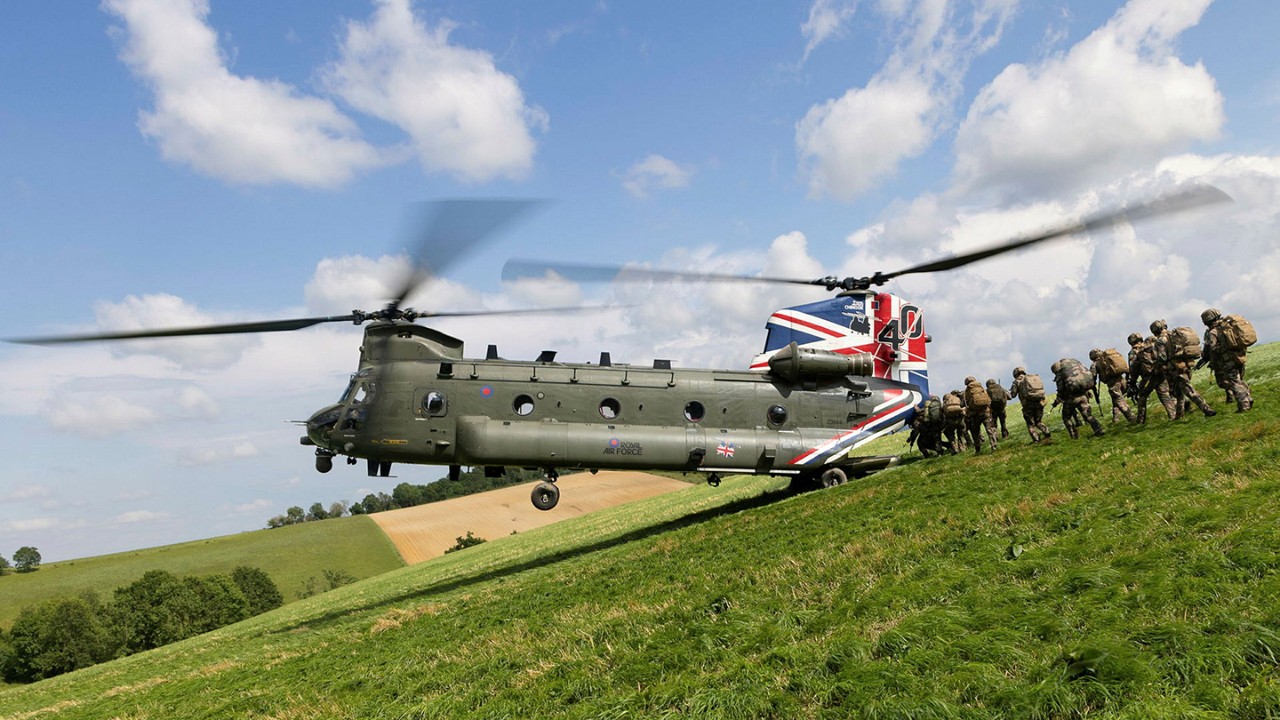 UK Military helicopter landing in field