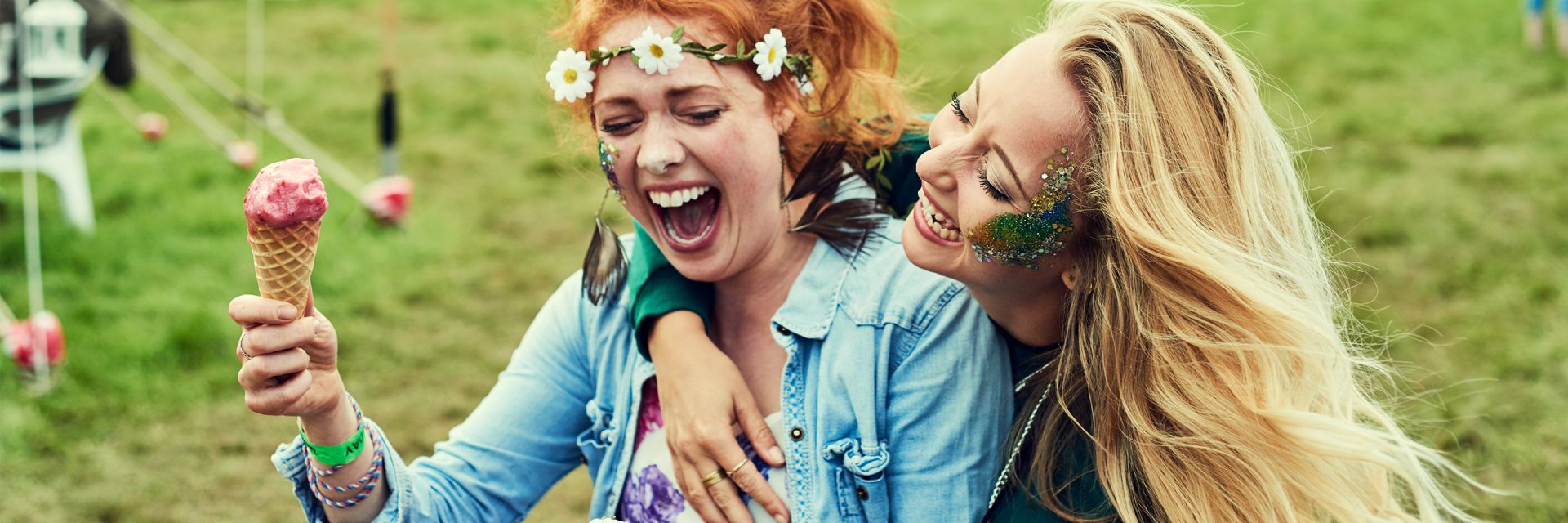 Women wearing flower headbands at a festival