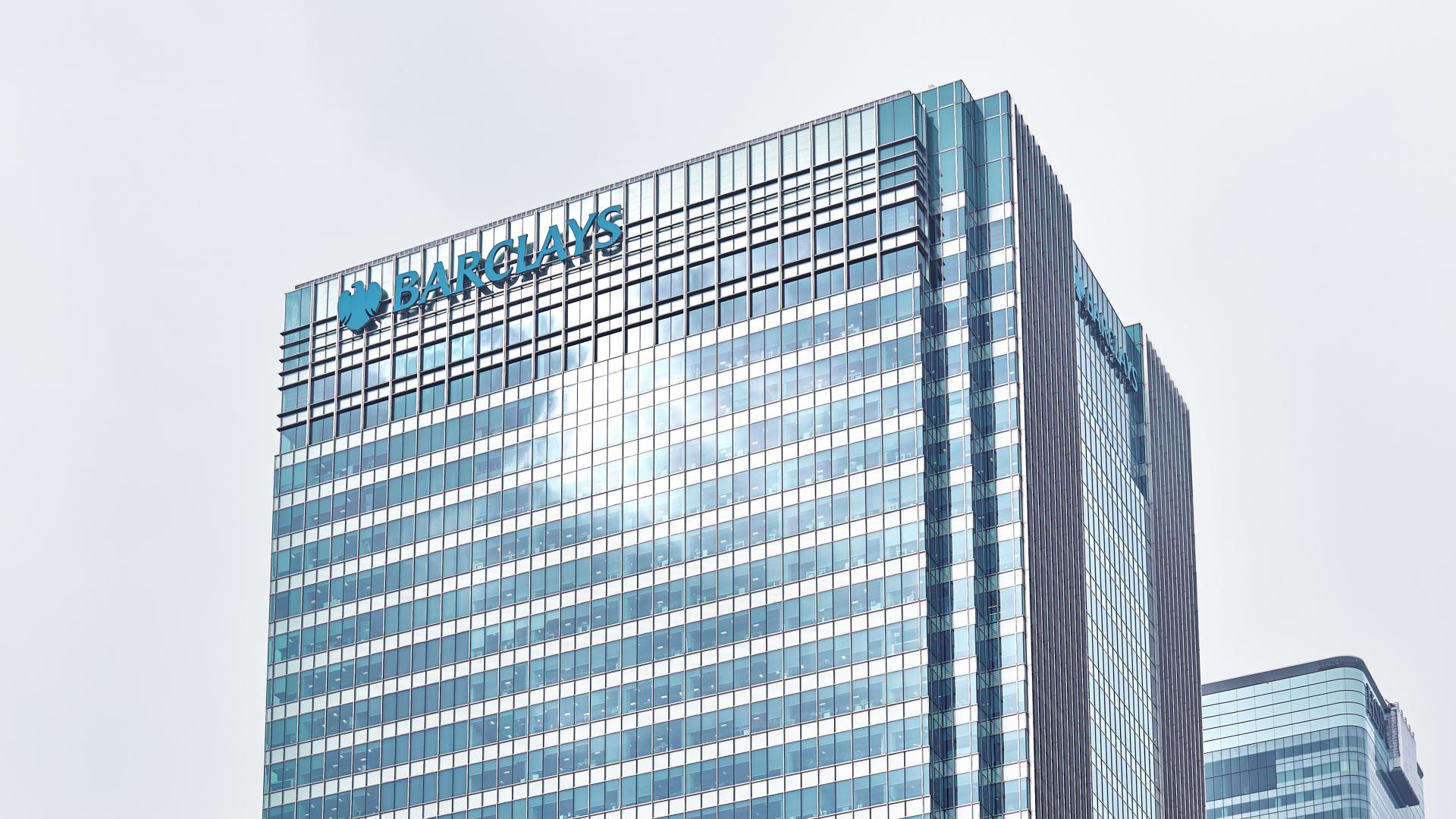 Barclays office building with blue sky.