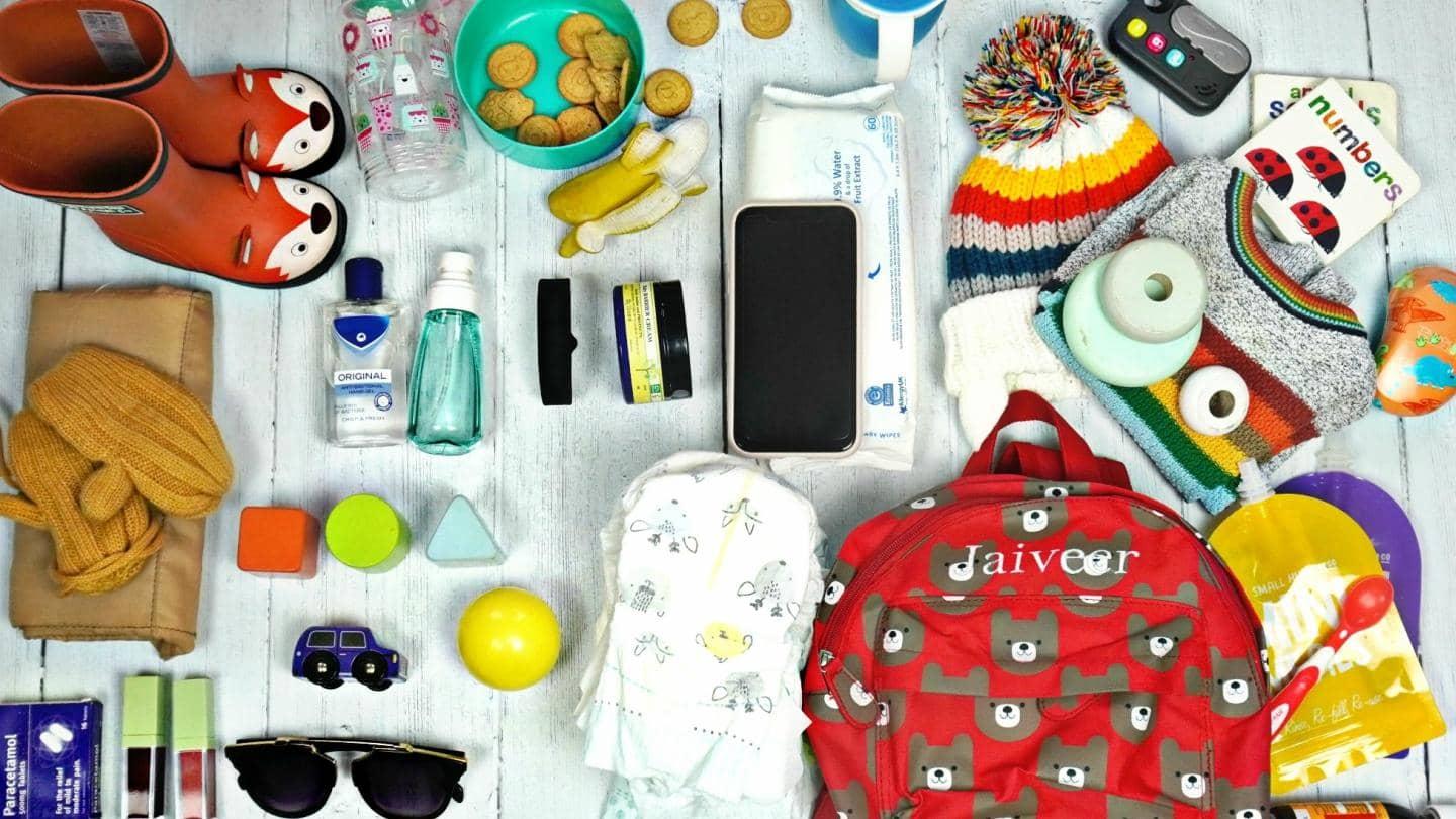 Flat-lay image of some items which parents carry with them when out with their children