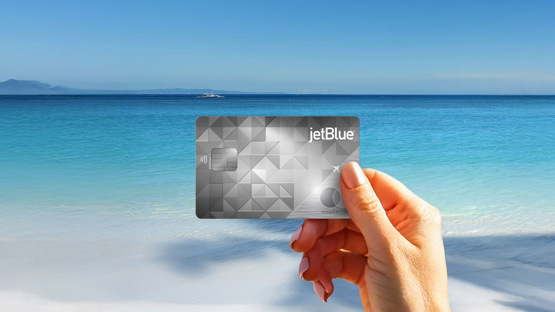 Jet Blue card held in hand