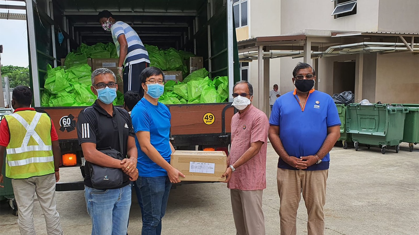 Men at a food bank lorry loading supplies