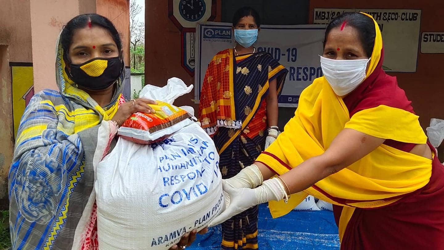 Two women holding a support kit created by Plan India.