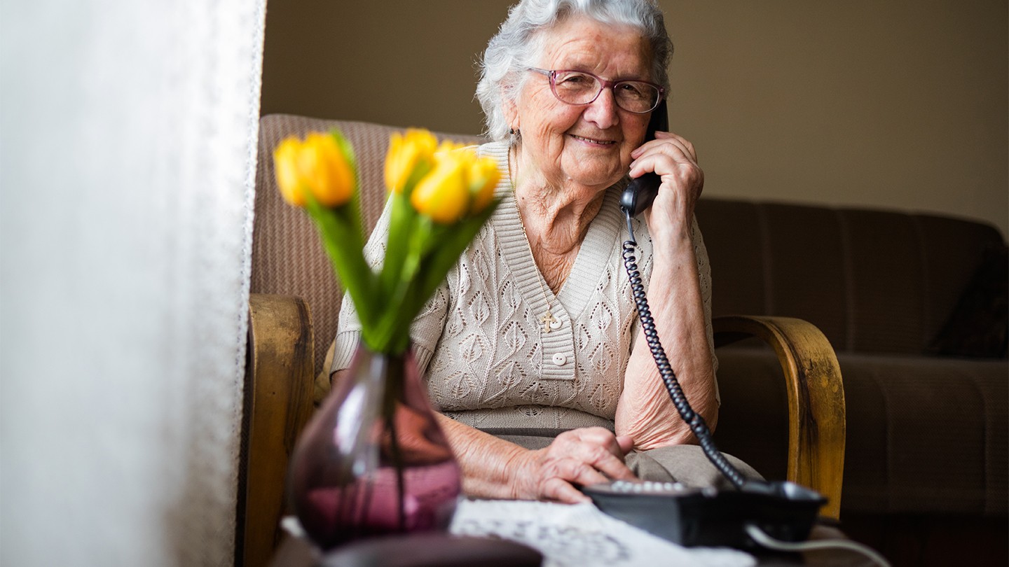 AGE UK service recipient on the phone