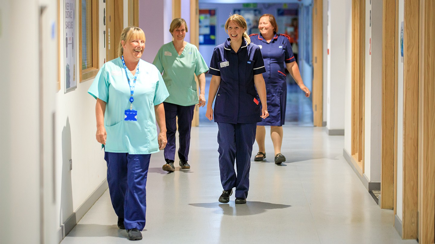 NHS staff in a hospital corrider