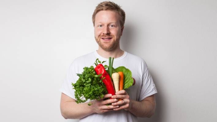 Timo Boldt holding vegetables