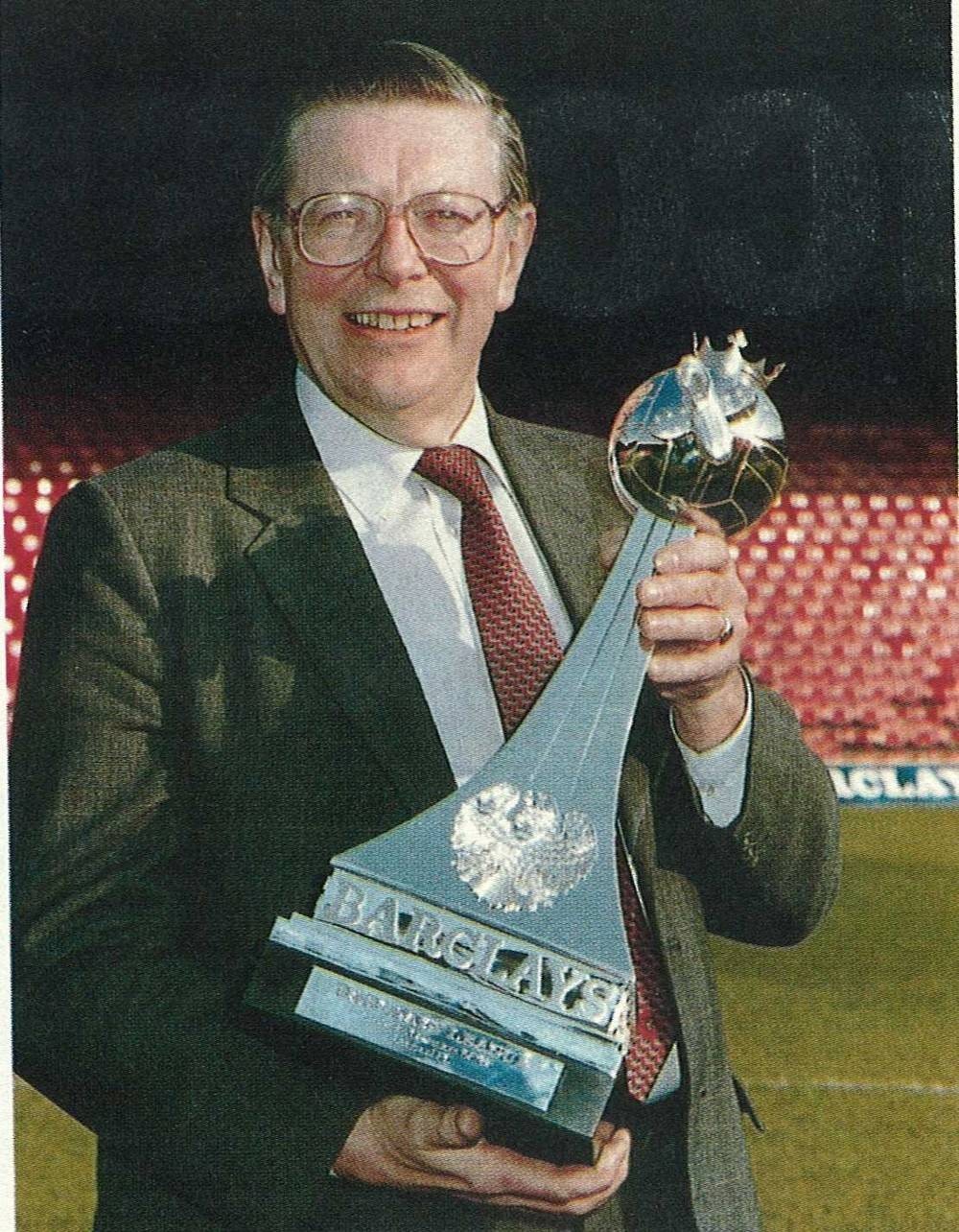 Former Barclays Group chairman John Quinton with the Football League trophy