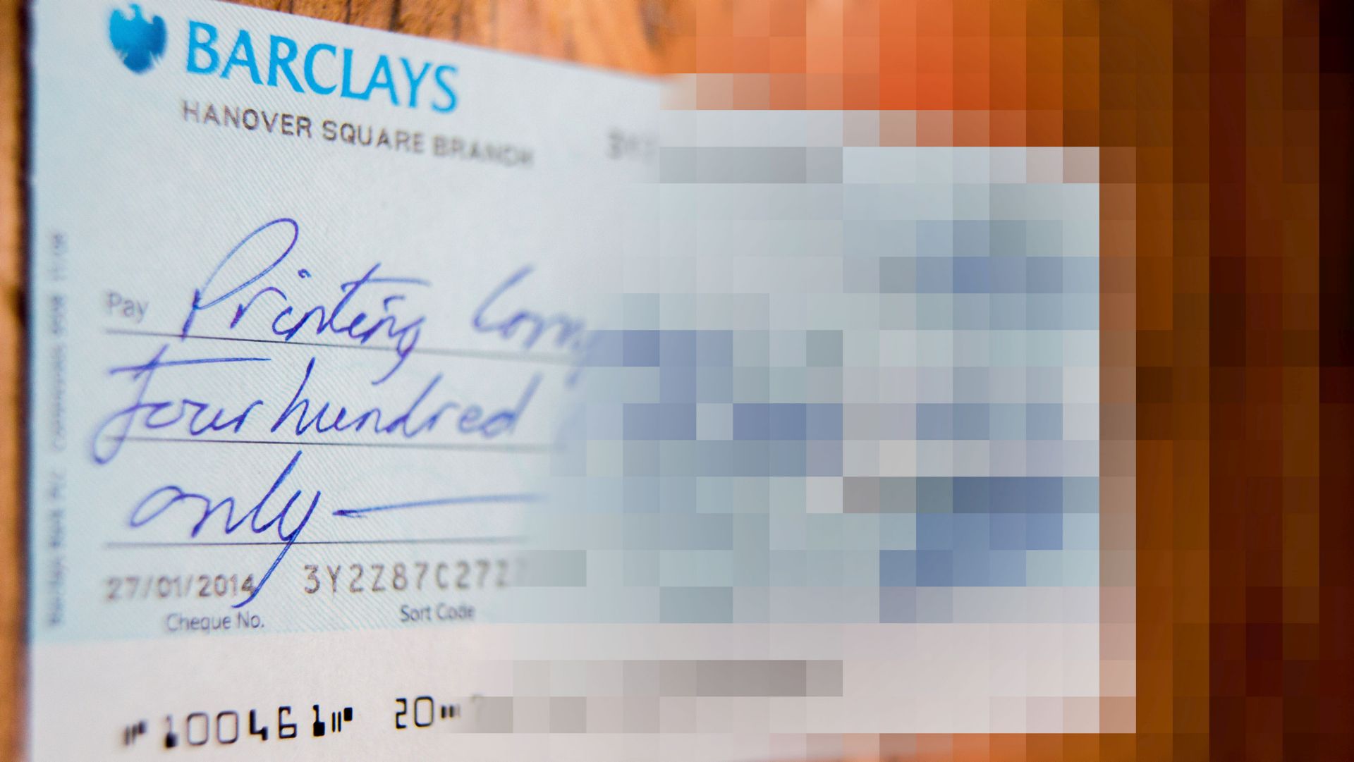 A cheque with a blur effect applied to it