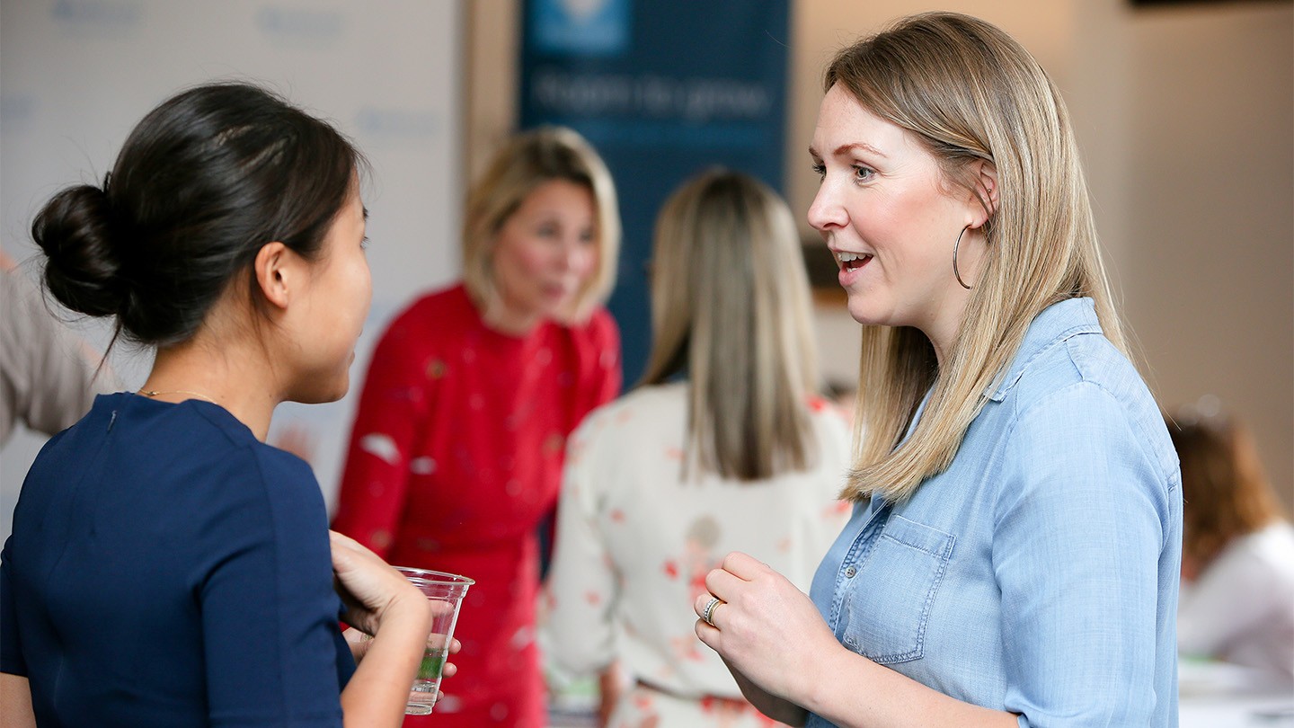 Two women talking to each other at a Barclays Female Founders Forum event.