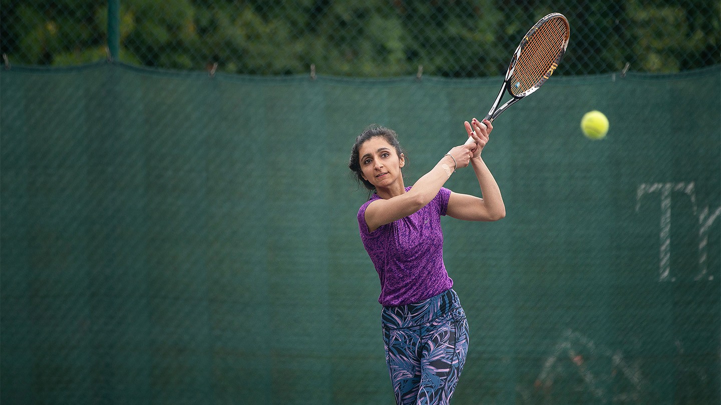 Barclays colleague Kiran Irshad plays tennis.