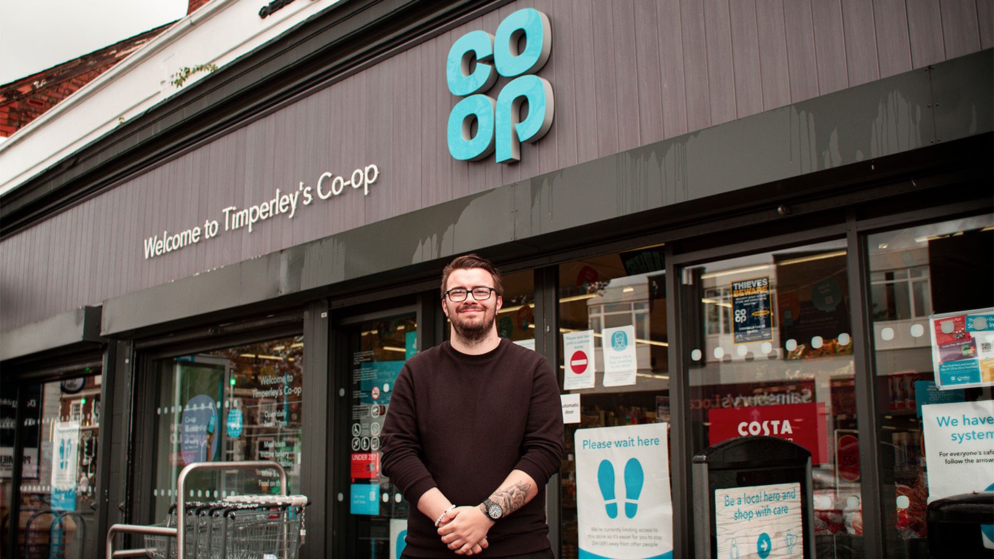 Aiden standing outside the Co-op food store in Timperley.