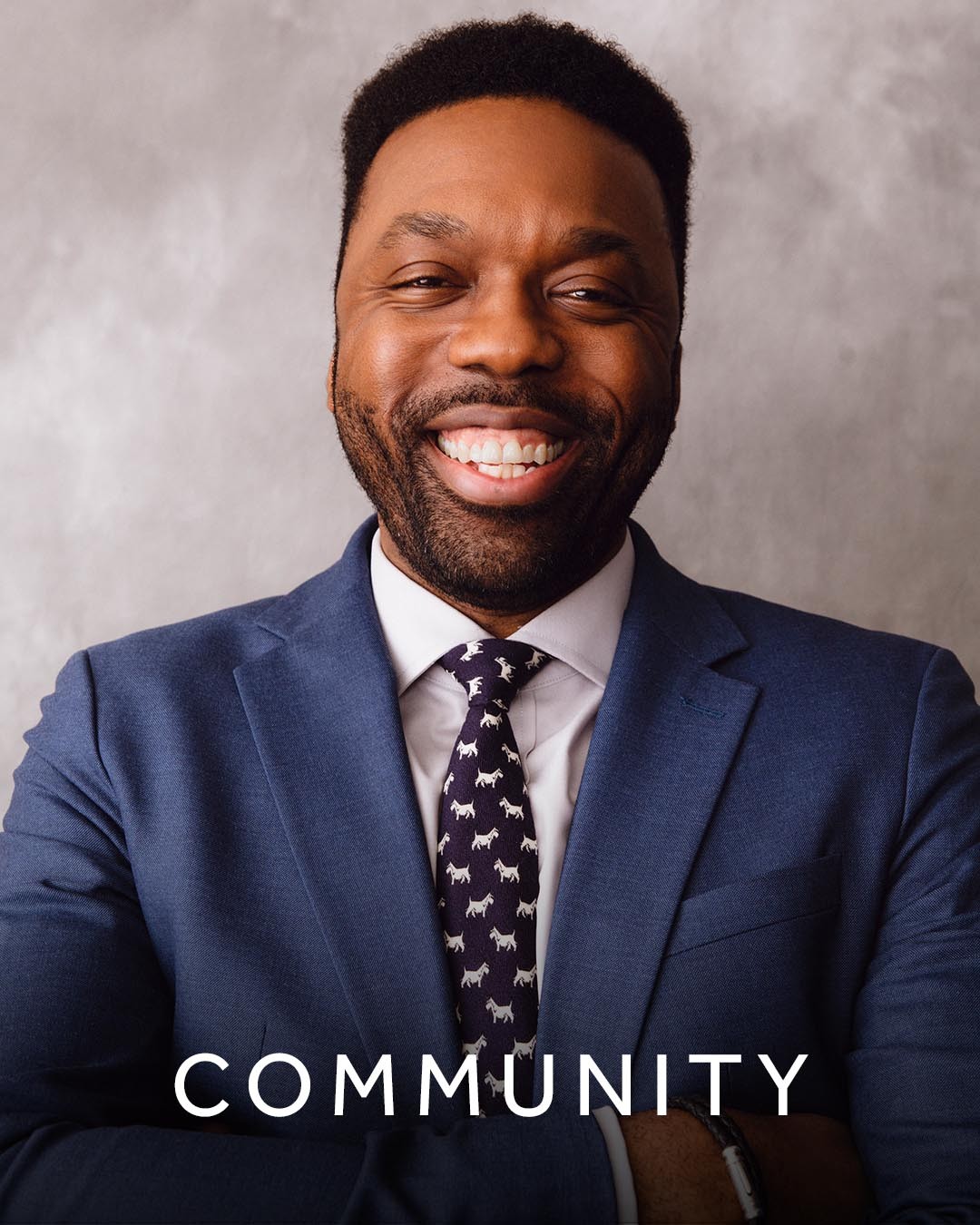 An image of Ade Ogunrinu overlaid with the word ‘community’.