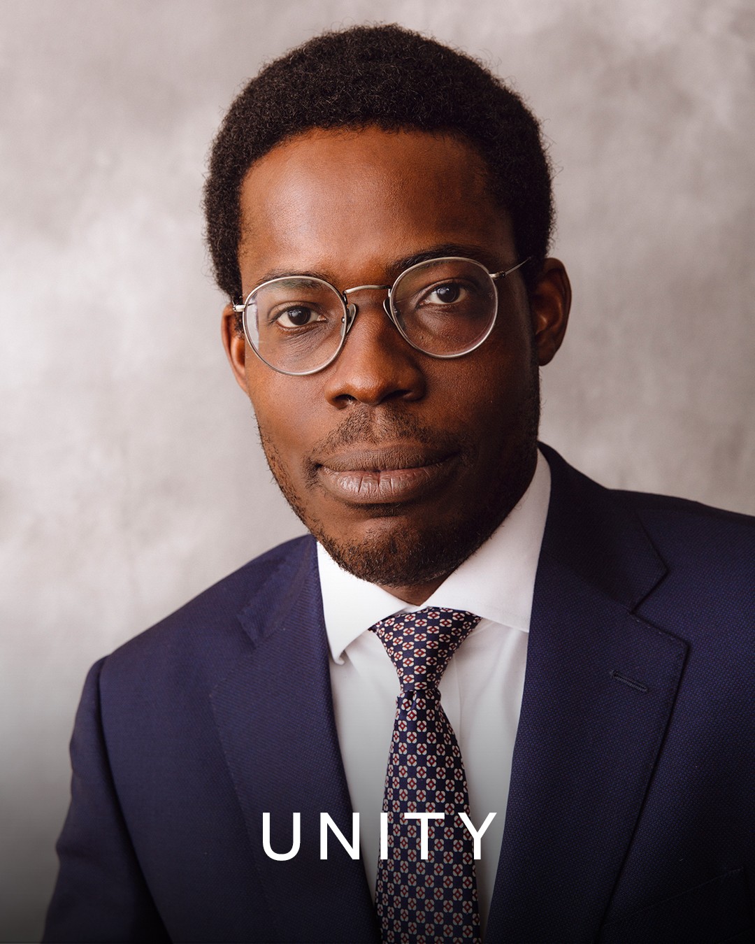 An image of Toks Sotande-Peters overlaid with the word ‘unity’.  
