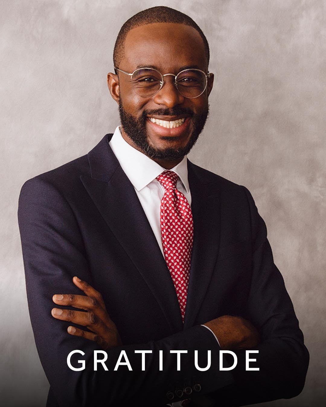 An image of Yemi Akiolu overlaid with the word ‘gratitude’.  