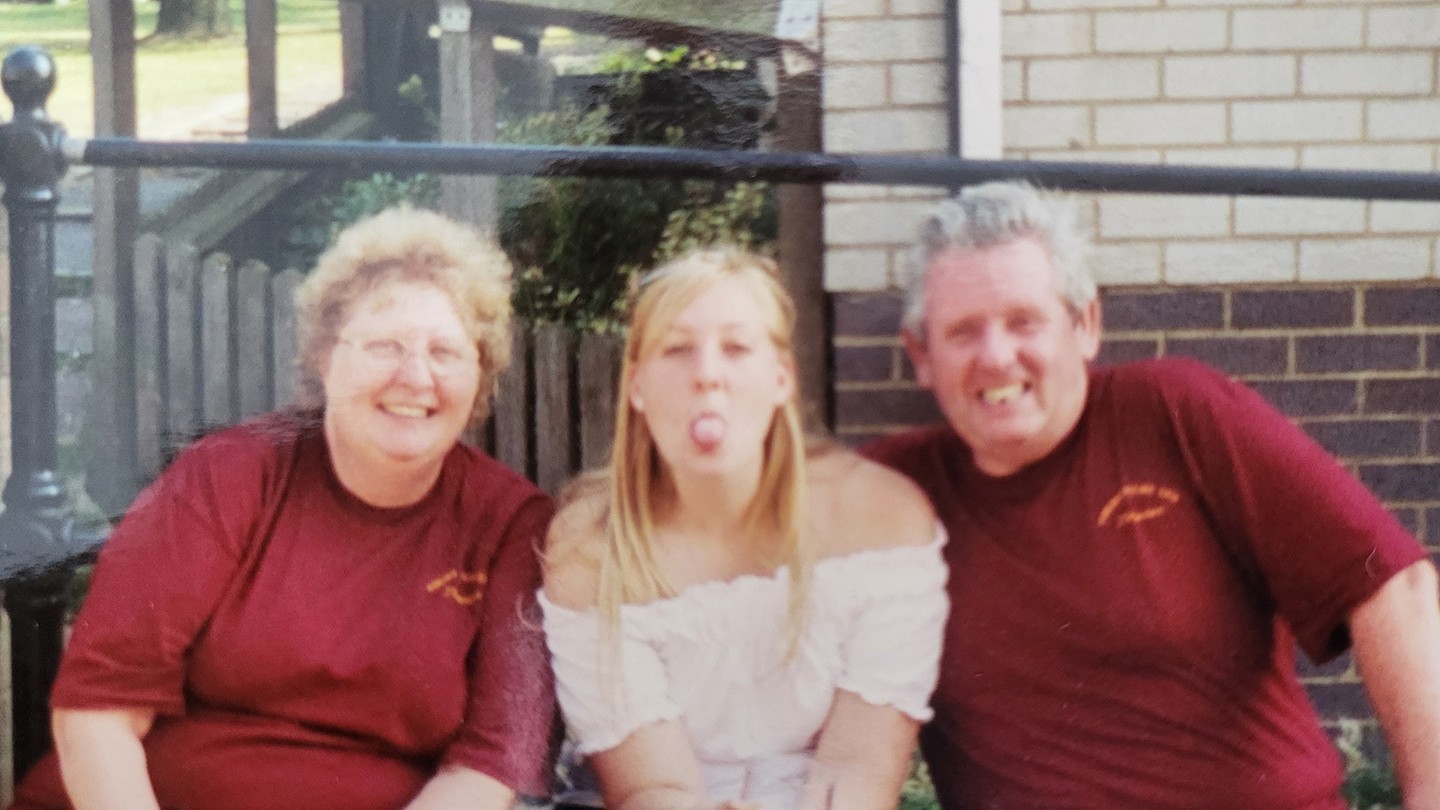 Kirsty Morris as a young adult with her parents. 