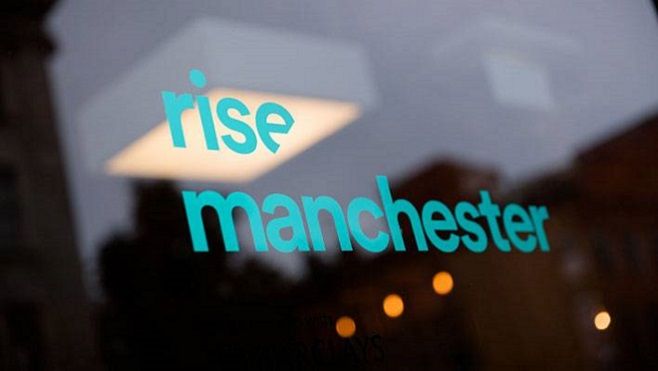 Rise Manchester lettering on glass