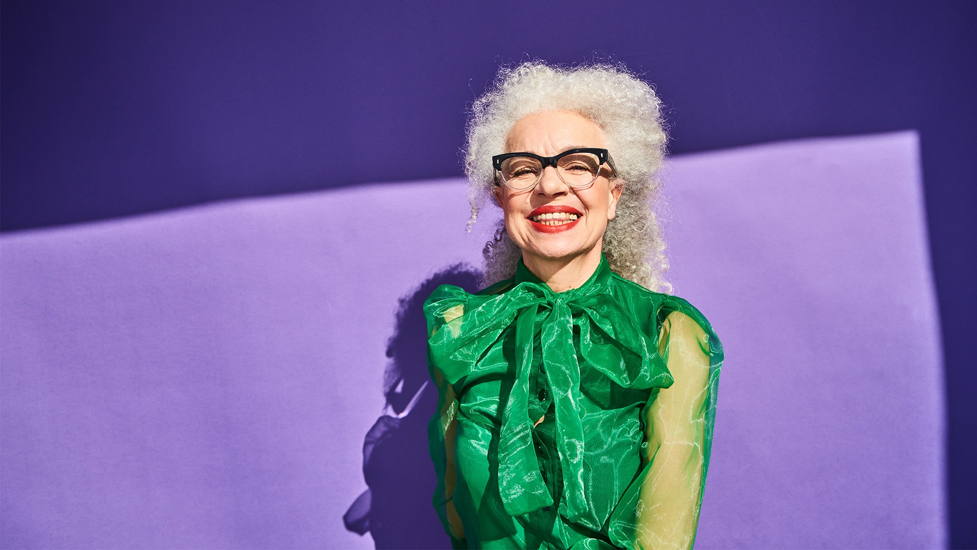 Older woman on purple background