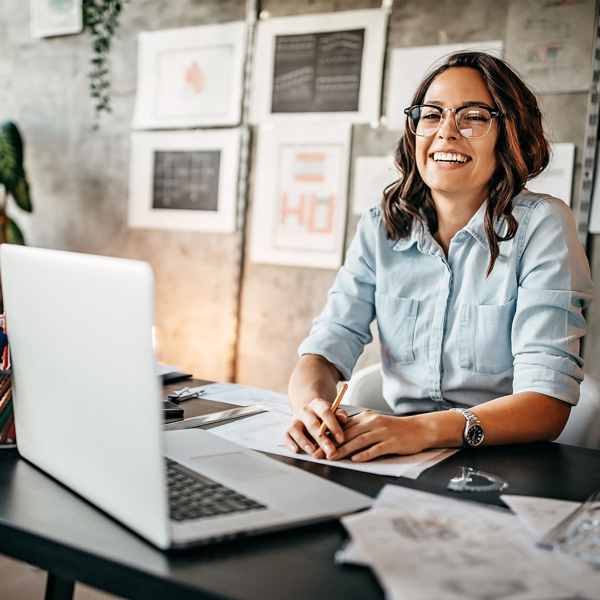 Determined busy woman working on new architectural project in her home office